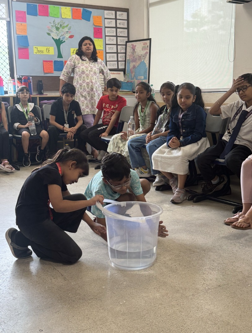 Children running their own investigation with water