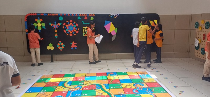 Children using a floor maths game in a learning space